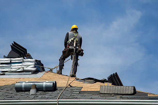 Professional Gutter Installation technician working in Stow, MA